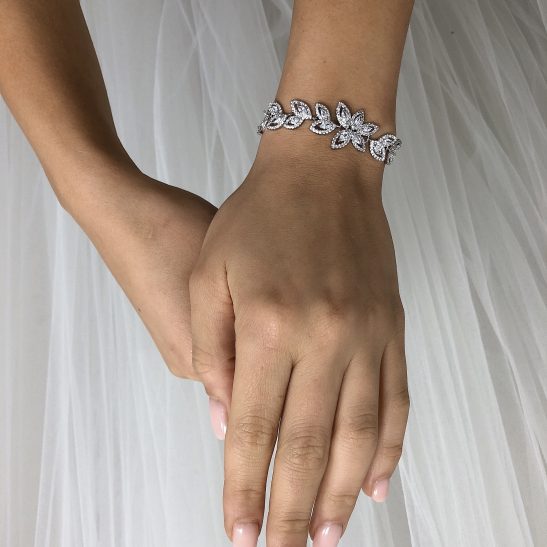 An elegant bracelet for the most graceful bride. You will dazzle the day away wearing this classic crystal and silver bridal bracelet. The small crystals surrounding the marquise crystals are simply magnificent and it's easy to see a lot of work has gone into creating this stunning bracelet. We can custom the length to fit your wrist size. Just mention the length you need when ordering.