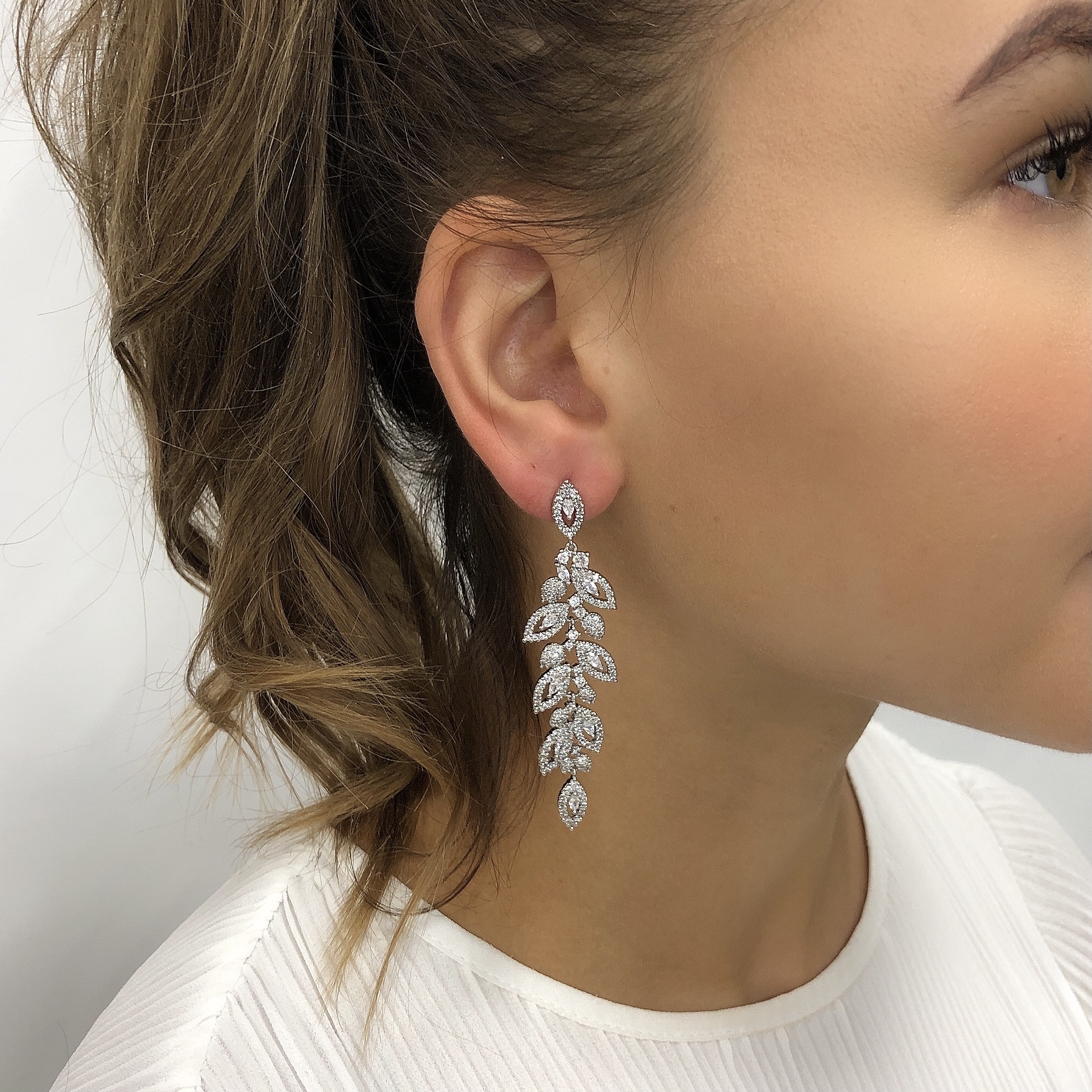Made of the finest precision cut cubic zircons the quality of these bridal earrings is noticeable at first glance. nIntricately set crystals are joined together to create this stunning design. nFinished in allergy and nickel free rhodium plating to add to a worry free day.