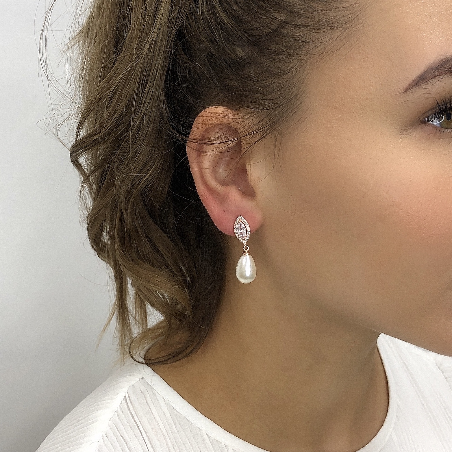 Is there a better combination than crystal and pearl for a bridal earring? \nThese pretties have precision cut cubic zircon tops and are evenly balanced with a pearl drop. \nAllergy and nickel free, all you need to worry about is how much you’ll shine on the wedding day.