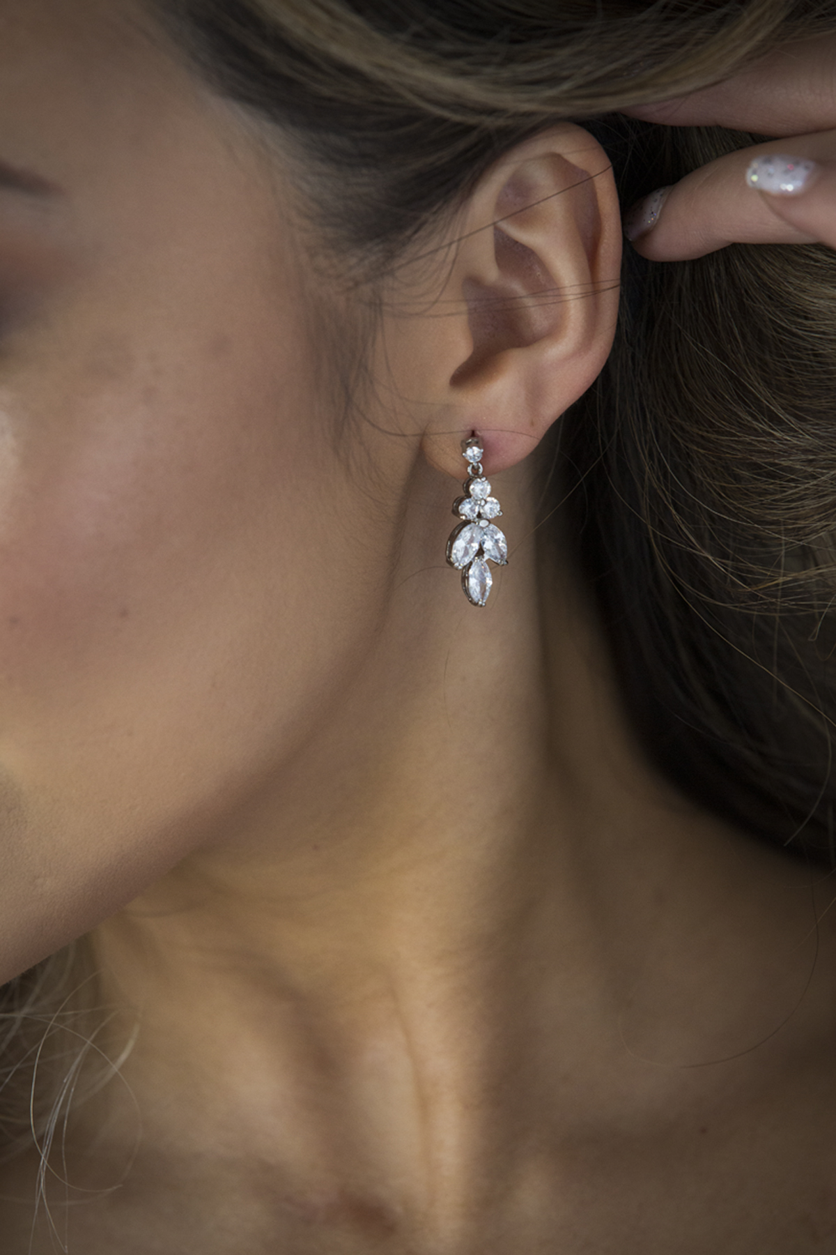 You will feel like the glamorous bride you deserve to be with these regal crystal and silver teardrop earrings. A classic and beautiful design that has been crafted with careful attention to detail. The crystals hang delicately giving a soft and romantic feel and are one of our most popular designs.