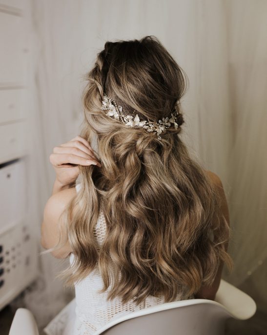 This bridal headband consists of a striking arrangement of silver and crystals that is chic and stylish. No matter the hair style, this head piece always works, fitting in perfectly with either a messy bun, half up bridal hair or the ‘on trend,’ finger waves with middle part. With an abundance of crystals you will feel gorgeously glamorous every time you wear this high-fashion creation.