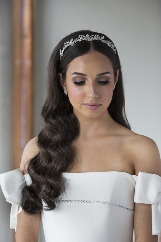 A wave of delicate crystals on a silver headband make this a must-have piece for the fashion-forward bride-to-be. You will have a sentimental love of this bridal accessory the moment you wear it. It will be a prized piece in your accessory collection and we can even imagine occasions it would be worn again.