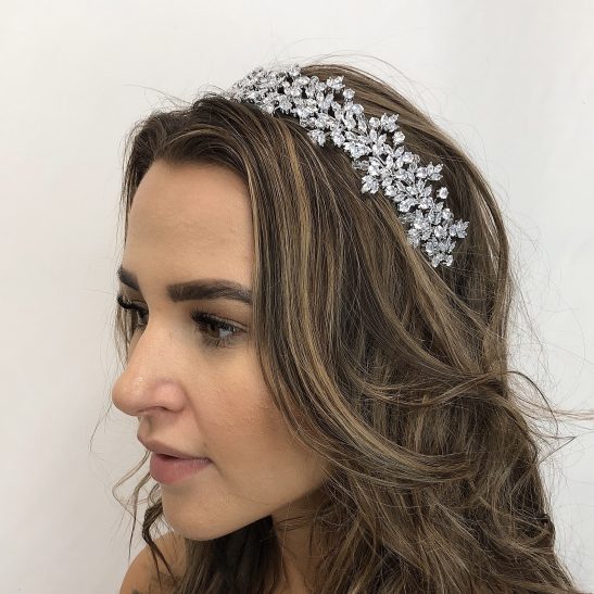 We love the affect created with various shaped crystals that are meticulously assembled with the finest grade cubic zirconia. Individually hand set, just like diamonds, their brilliance will shine bright, catching the light as you enjoy your wedding day. The intricate details of this bridal headpiece will be appreciated by the discerning bride and is a stunning addition to your wedding look evoking a confidence that lets you shine inside and out.