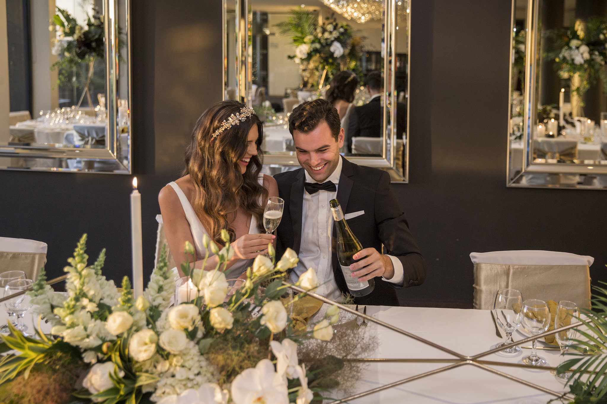 wedding image of bride and groom drinking champagne
